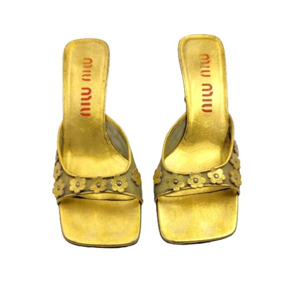 miu miu gold daisy flowers embellished kitten heel mules.